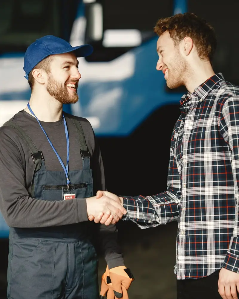 Local SEO services: a local service pro shaking hands with a new customer